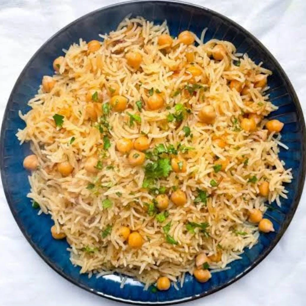 Rice and chickpeas served in a dark bowl